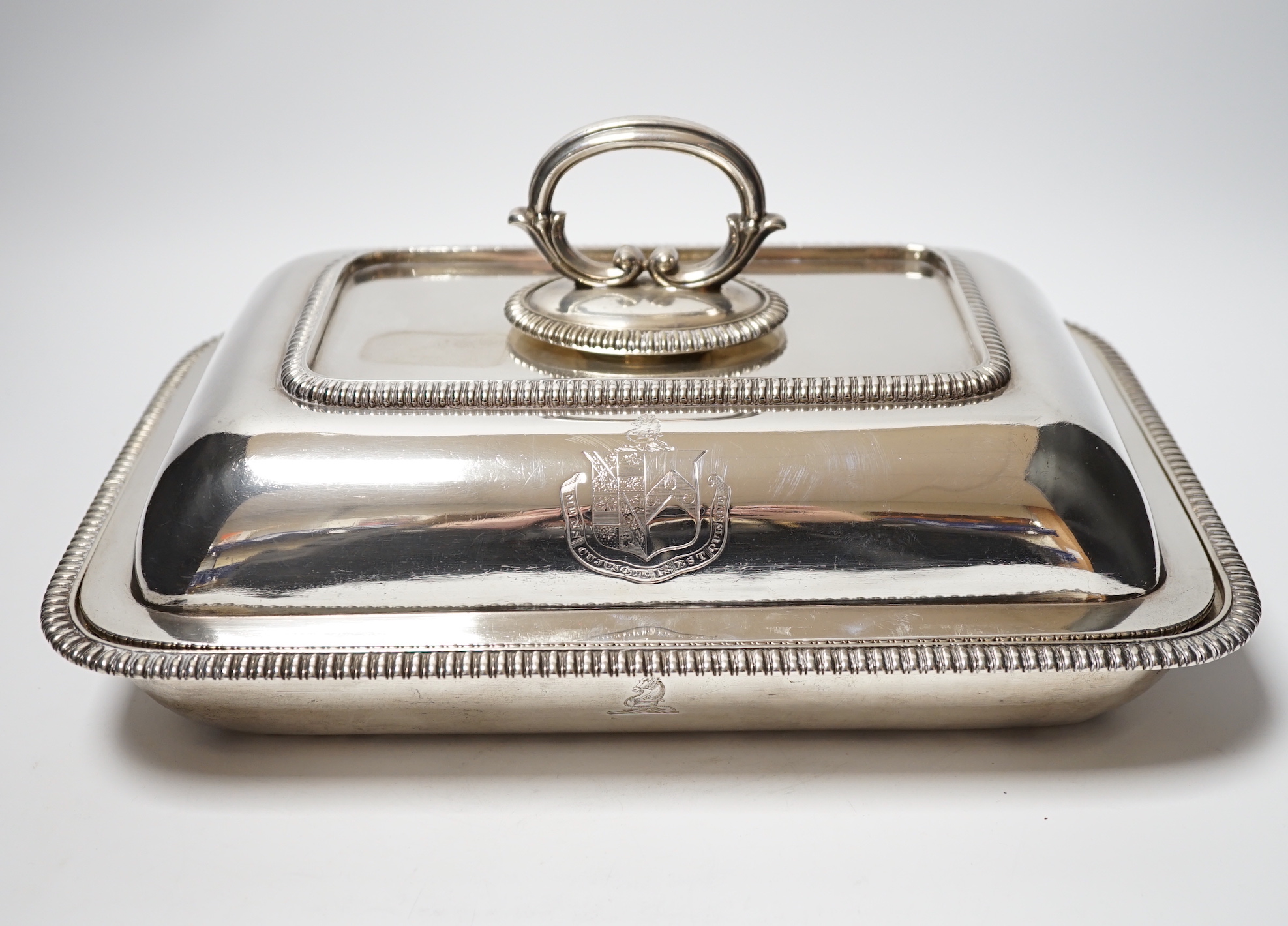 A matched silver entree dish and cover, base Foskett & Stewart, London, 1809, 31.2cm, cover makers mark rubbed, London, 1806, 64.4oz, with a silver plated handle